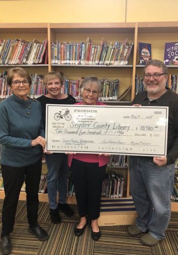 Grace, Linda, and Susan present our annual donation to David Bauman, Director.